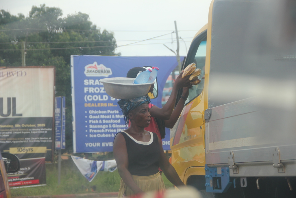 Roadside vendors offering water and food to travelers and bypasses, Ghana 2026