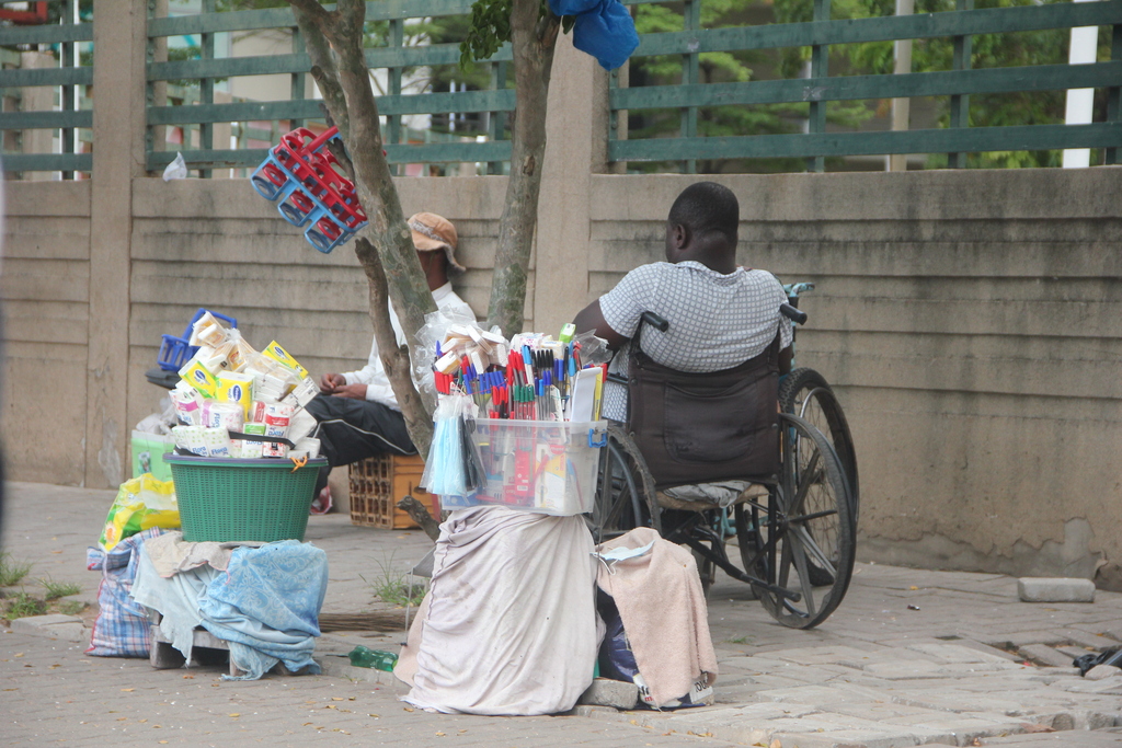 Accra 2026 - Disabled offering goods. Not very common for the disabled in Ghana, to even own a wheelchair.